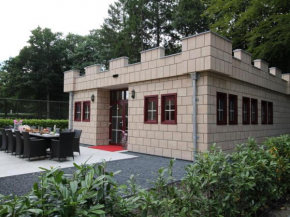 Designed home with bedstead surrounded by forest